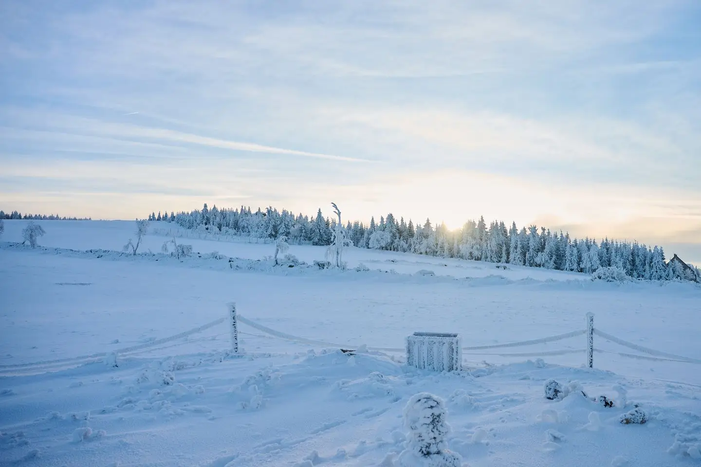 View into the winter Ore Mountains landscape from the terrace of glamping Na Malém Háji